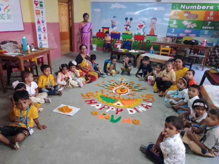 nursery kids made the rangoli with the help of their teachers